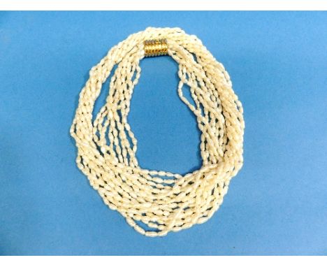 A freshwater pearl multistrand Necklace, the eight strand necklace with a 14ct reeded barrel snap marked 585.