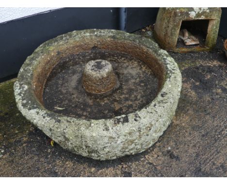 An antique granite circular Grinding Trough, 41in diameter x 14in high (104cm x 35.5cm).  Note; This lot can be Viewed at and