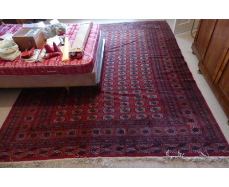 An Afghan Belouch Carpet, 154in (391cm) long x 112in (284.5cm) wide.