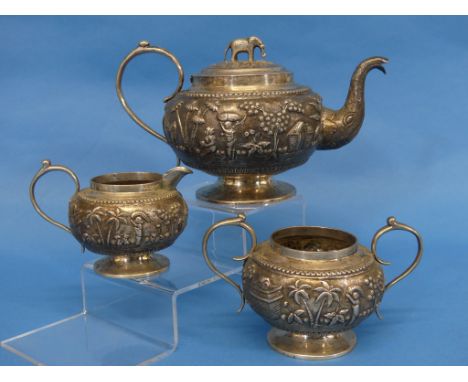 An Anglo-Indian silver three piece Tea Set, unmarked but tested, of circular form, the teapot with cast elephant finial and e