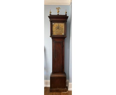 Ogden, Halifax, an oak 8-day longcase clock with two-weight movement striking on a bell, the twelve-inch square brass dial wi