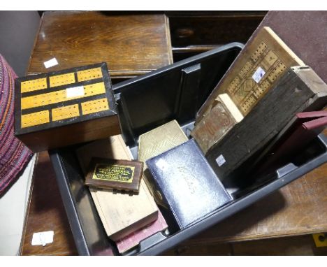 An early 20thC folding Cribbage Board, with four bone pegs, together with other traditional games including 'The Foster Whist