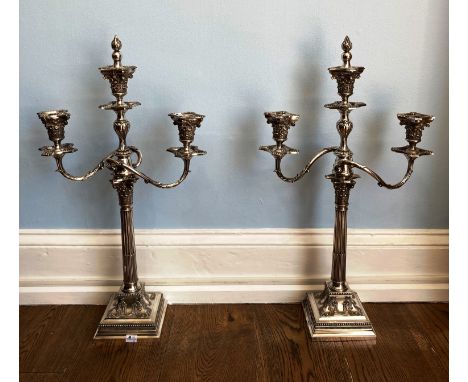 A pair of silver plated three light Candelabra, by James Dixon &amp; Sons, in a classical style with fluted columns on square