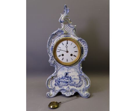 ROYAL BONN BLUE &amp; WHITE DELFT ENCASED MANTEL CLOCK of waisted and scrolled form with windmill scene to the front ETC and 