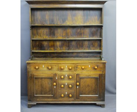 MID 19TH CENTURY NORTH WALES DRESSER, oak and pine sided, the three shelf rack with wide bordered back over a base section of