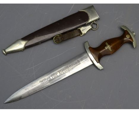 GERMAN THIRD REICH SA DAGGER, the wooden grip with inset enamel SA badge, an eagle with swastika, the blade etched 'Alles Fur