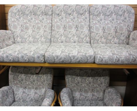 ERCOL LIGHT WOOD STICKBACK THREE PIECE LOUNGE SUITE of three-seater settee and two matching armchairs, 100cms H, 196cms W, 66