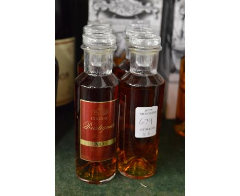 Six miniature bottles of Rastignac XO cognac.