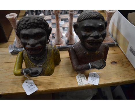 Two cast iron money boxes. Notice from the the-saleroom.com: These items are listed on the basis they are illustrative of a b