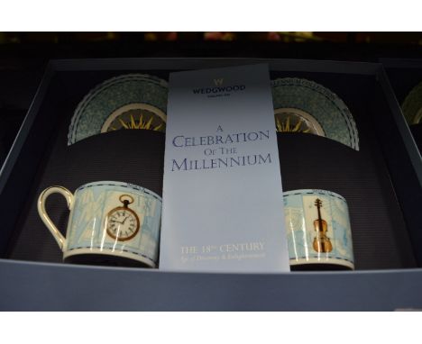 A set of four Wedgwood pairs of coffee cups and saucers commemorating four decades.