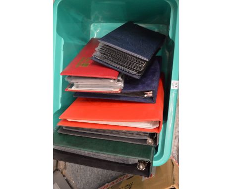 A quantity of first day covers in albums.