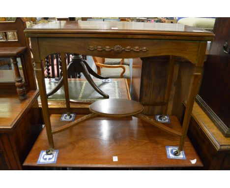 A mahogany fold-over card table.