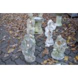 Four various reconstituted stone garden figural ornaments (one decapitated).