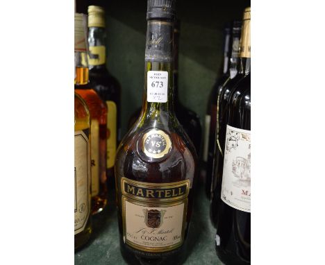 Courvoisier cognac, a 1.5 litre bottle together with a bottle of Martell cognac.
