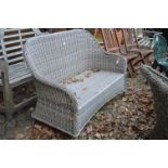 A matching settee with cushion.