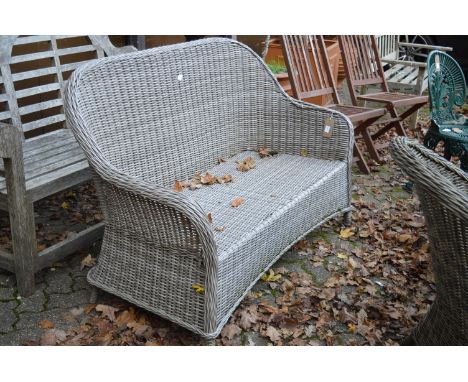 A matching settee with cushion.