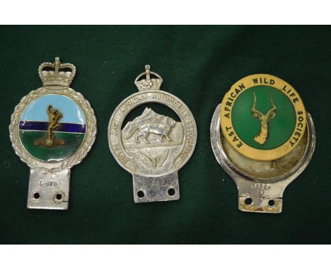 A chrome plated Royal East African automobile association bumper badge and two others.