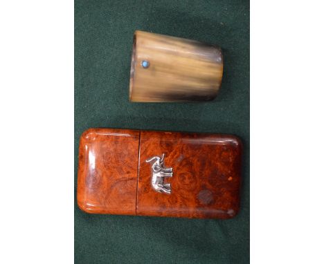 A cigar case and horn beaker.