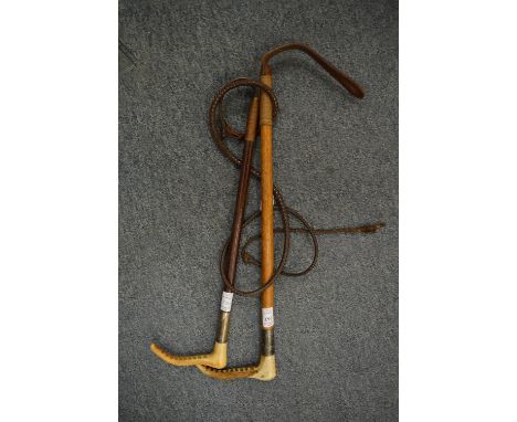 A silver mounted riding whip and a silver mounted riding crop.