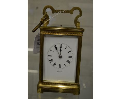 A brass striking carriage clock.