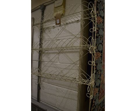 A wire work rack, an oak stick stand and a painted standard lamp.