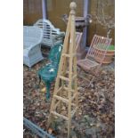 A wooden plant climbing obelisk.