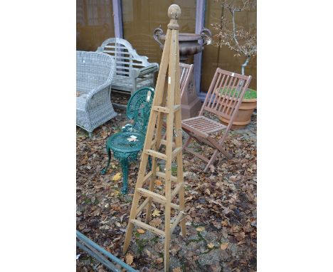 A wooden plant climbing obelisk.