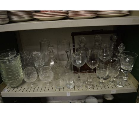 A quantity of glassware to include decanters, jugs, tantalus with mixed decanters and other items.