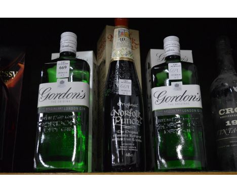 Two bottles of Gordons gin and a bottle of Norfolk Punch.