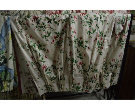 A pair of floral curtains, lined approx size 130cm wide x 156cm long.