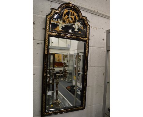A decorative Chinese framed mirror.