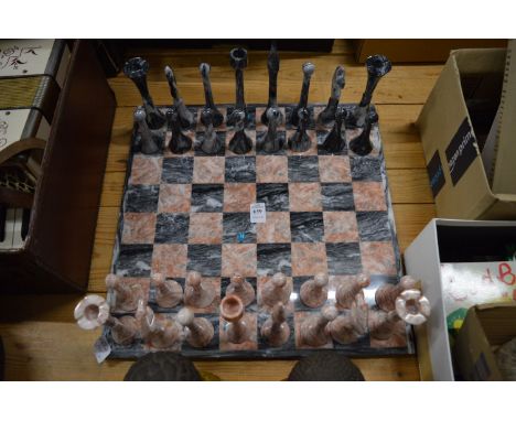 Marble chess set and matching chess pieces.