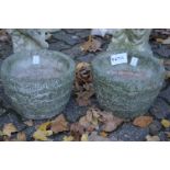 A pair of small reconstituted stone pots.