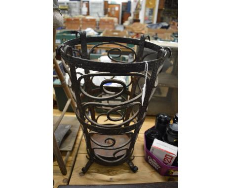 A wrought iron stick stand.