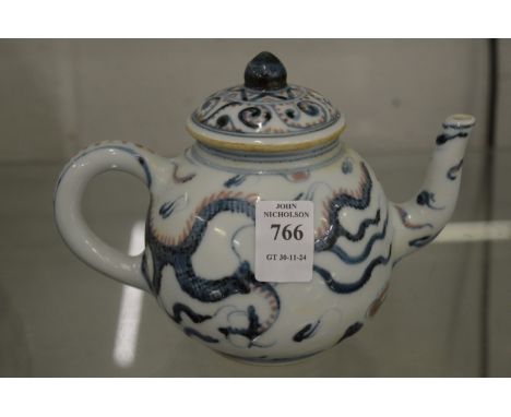 A Chinese blue, red and white decorated teapot.