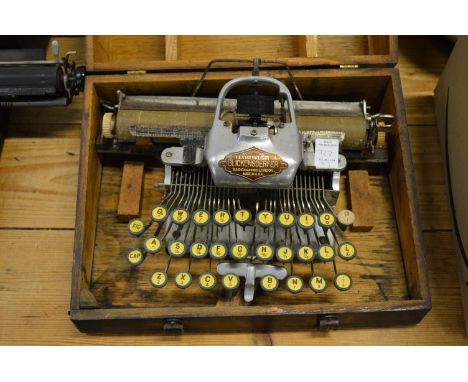 A Blickensderfer Featherweight aluminium typewriter and two other typewriters.