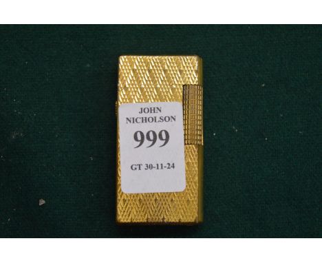 A Dunhill lighter.