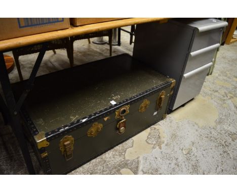 A trunk and a storage trolley.