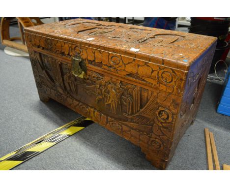 A Chinese carved camphor wood coffer.