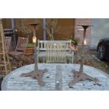 A pair of cast iron stands.