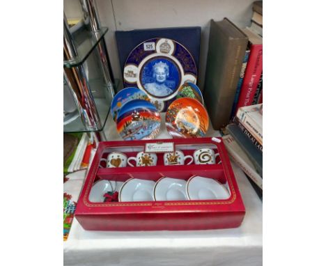 A quantity of Poole season plates, a boxed Coalport Queen Mother plate etc.