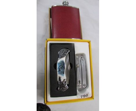 Two good pocket knives and a hip flask.