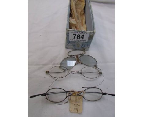 Three pairs of vintage spectacles.