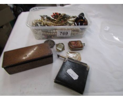 A mixed lot of costume jewellery, silver pencil. silver rimmed notepad, mother of pearl miniature purse etc.,