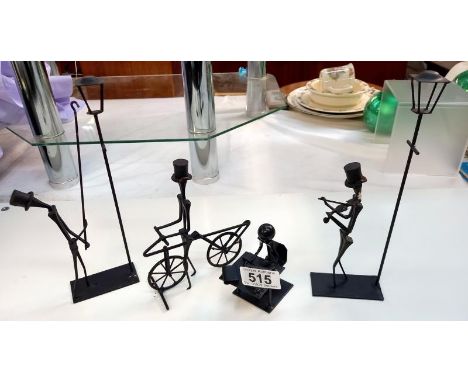 4 Iron handmade figures including lamp lighter, violinist etc.