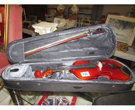 A Stagg violin in soft case. Length 28cm.
