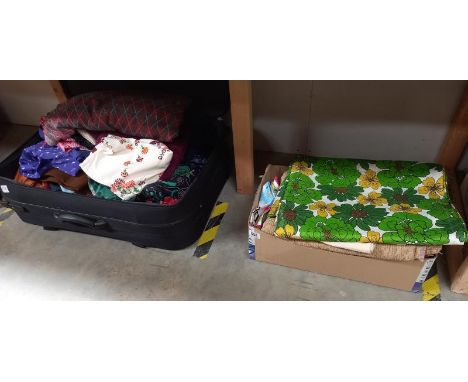 A suitcase and box of vintage linen including 1970's green floral pattern.