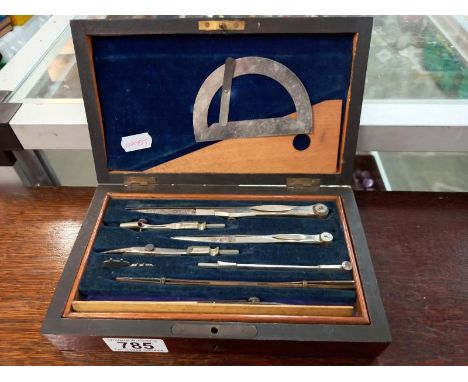 An Edwardian mahogany cased geometry set.