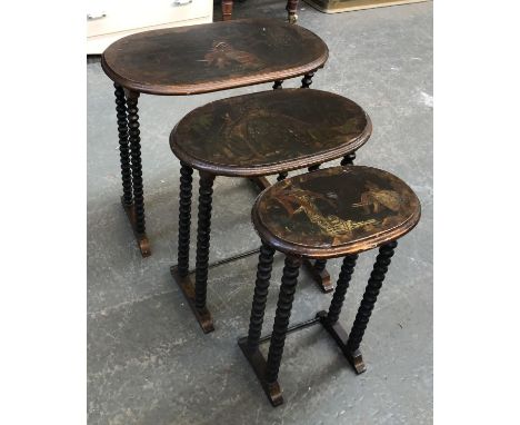 A nest of three tables with painted tops depicting elephants, on ebonised bobbin turned supports, the largest 57cmW 