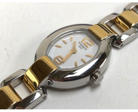 A ladies Tissot watch, with box and papers and spare links 